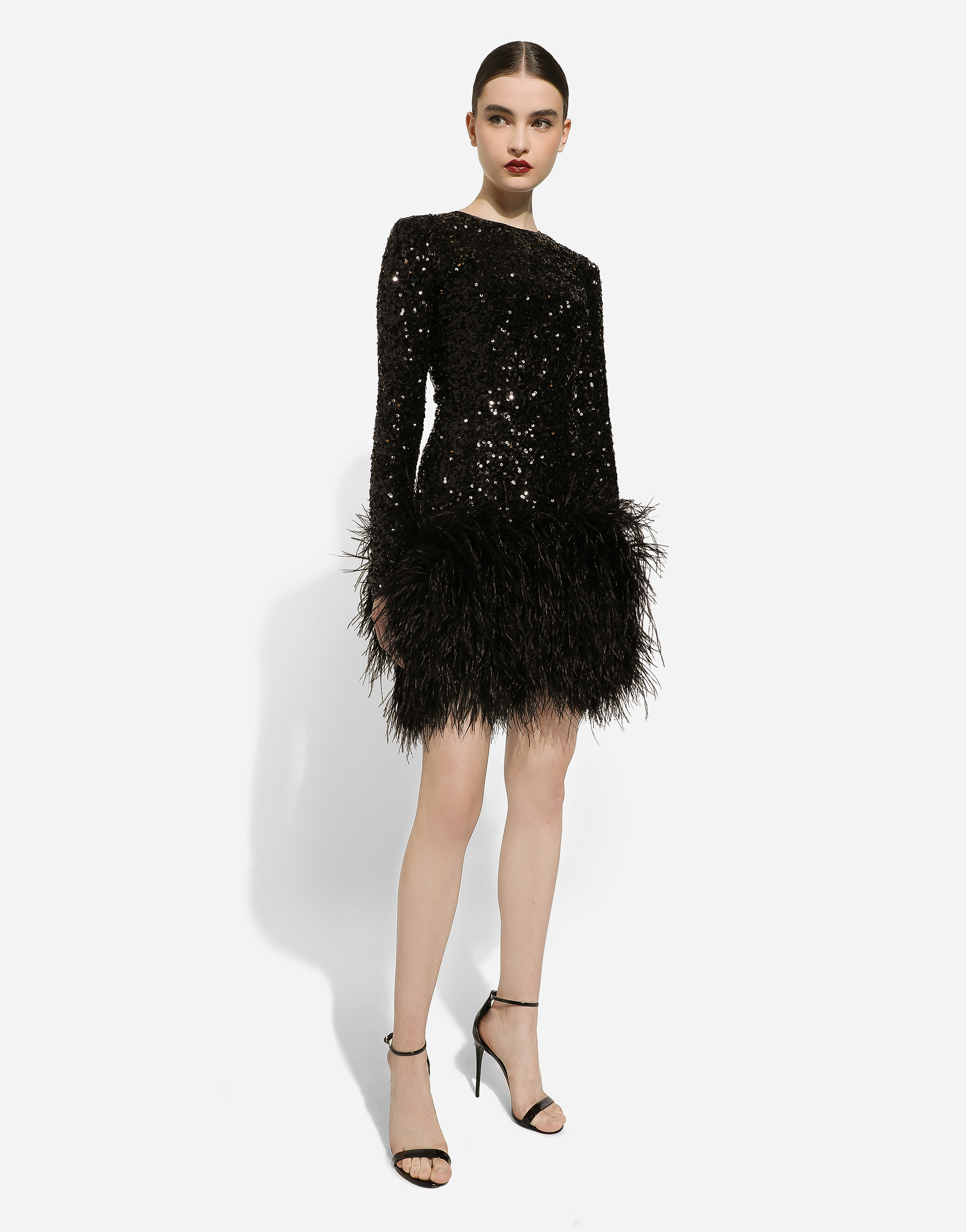 Short sequined dress with feather trim in Black for