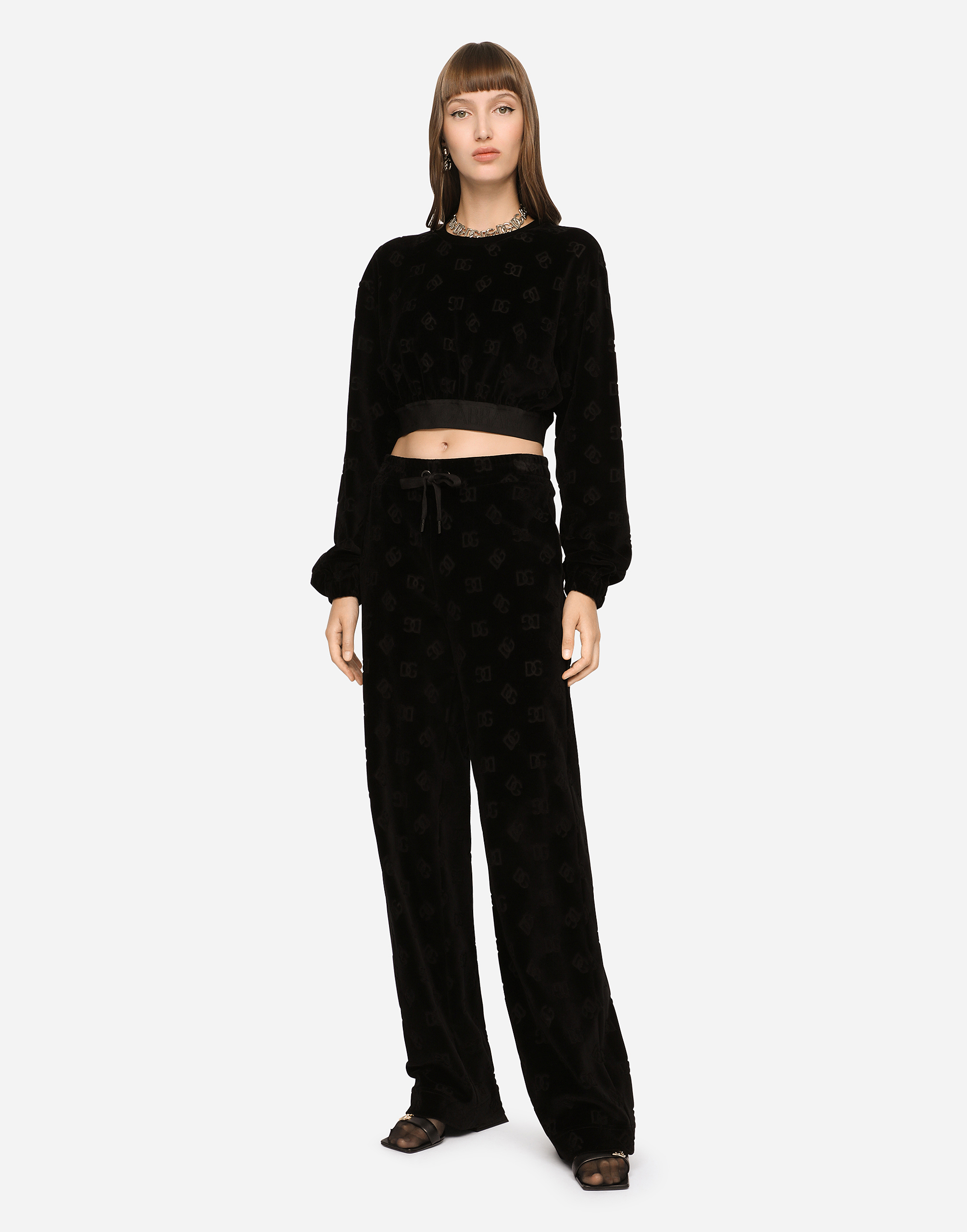 Dolce & Gabbana Flocked Jersey Pants With All-over Dg Logo In Black