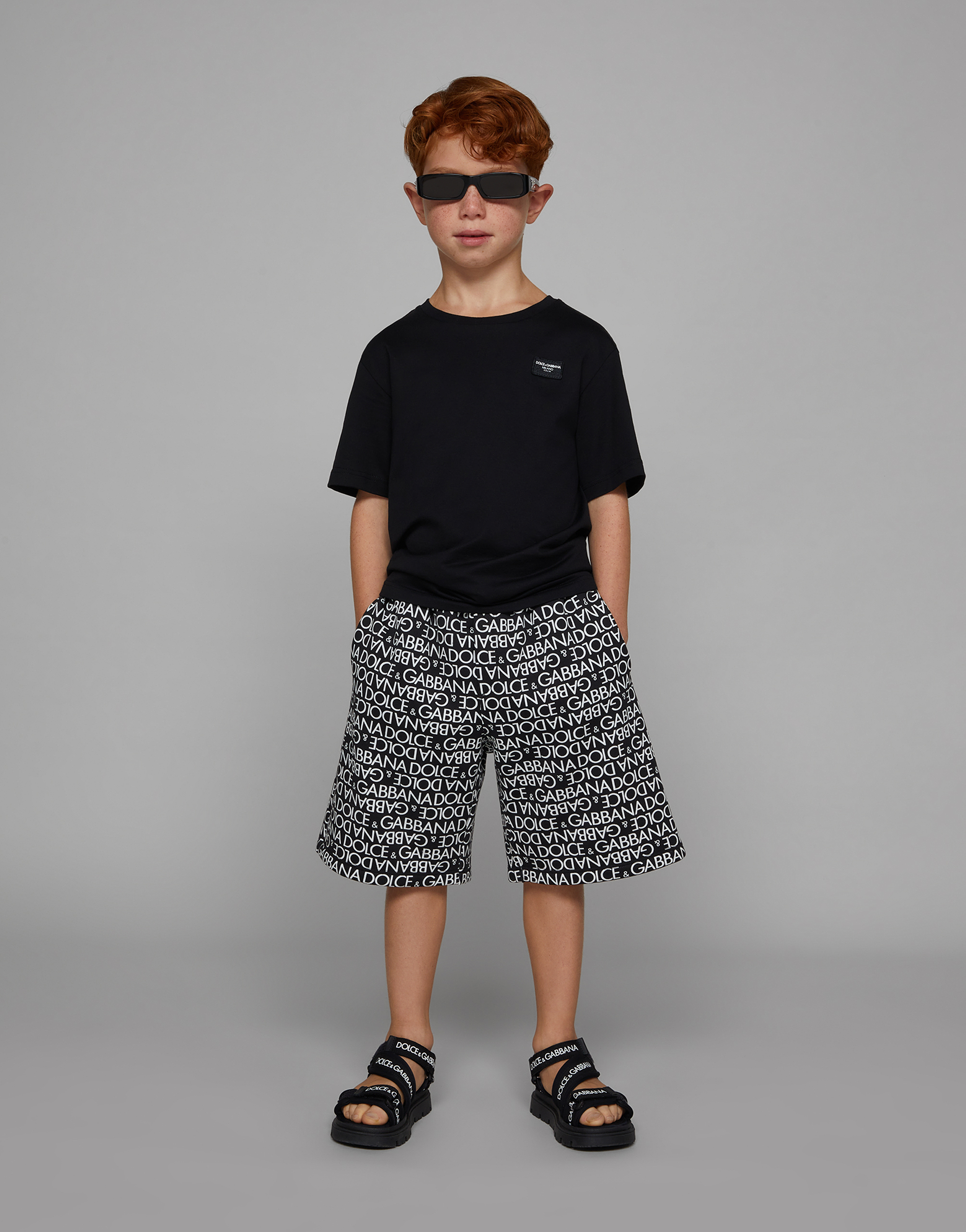 DOLCE & GABBANA COTTON JOGGING SHORTS WITH THE ALL-OVER LOGO PRINT