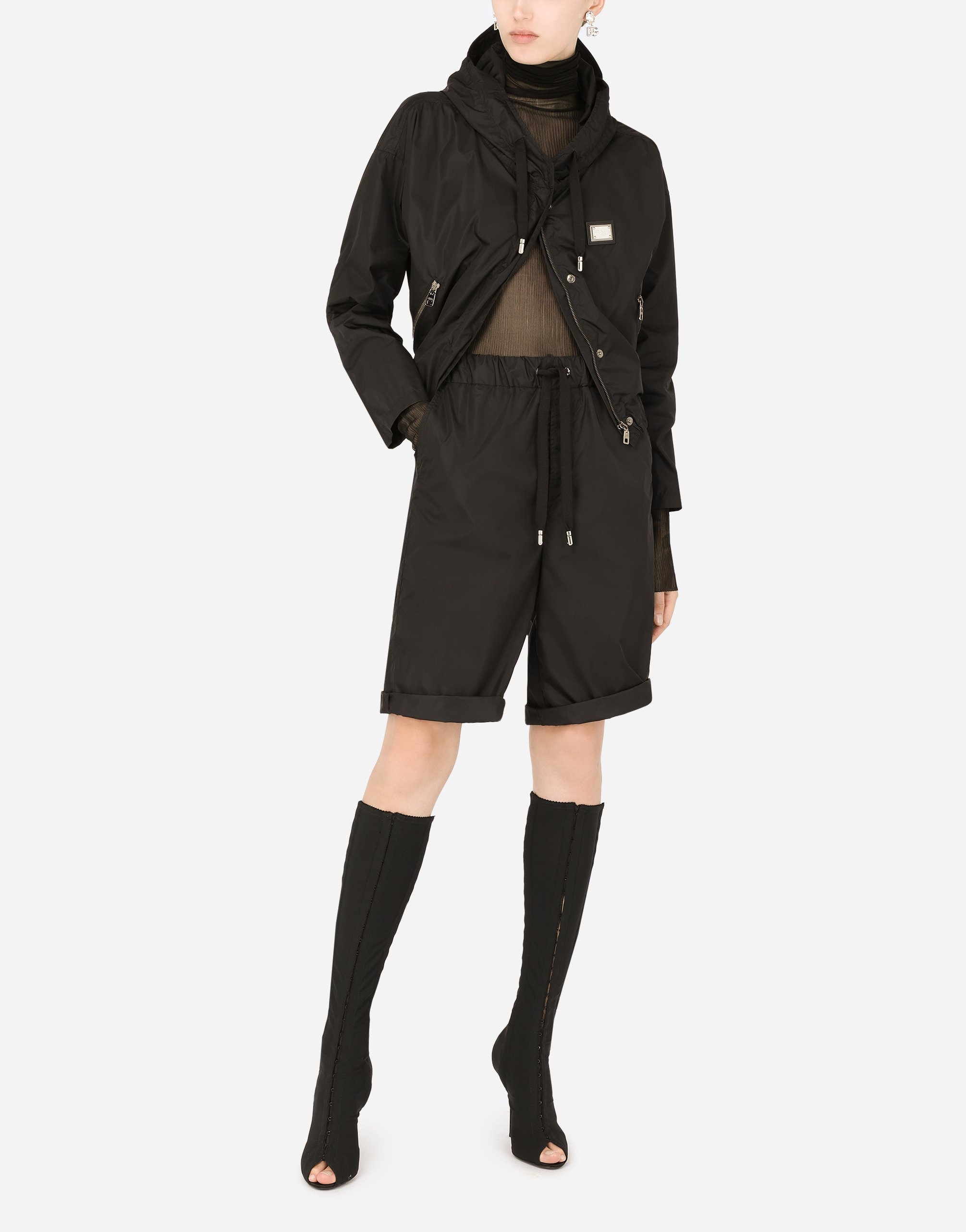 Technical fabric windbreaker with hood